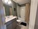Cozy bathroom with a shower, bath, vanity, and a mirror at 2883 Narcoossee Commons Way, St Cloud, FL 34771