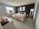 Primary bedroom featuring modern decor, carpet, and natural light at 2883 Narcoossee Commons Way, St Cloud, FL 34771