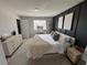 Primary bedroom featuring modern decor, carpet, and natural light at 2883 Narcoossee Commons Way, St Cloud, FL 34771