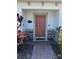 Inviting front door entrance featuring brick-paved pathway and decorative landscaping at 2883 Narcoossee Commons Way, St Cloud, FL 34771