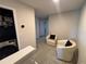 Hallway with seating area near laundry featuring neutral walls, and carpet flooring at 2883 Narcoossee Commons Way, St Cloud, FL 34771