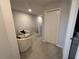 Hallway with seating area and staircase featuring neutral walls, carpet flooring and a closet at 2883 Narcoossee Commons Way, St Cloud, FL 34771
