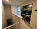Upstairs laundry room with modern washer and dryer and organization at 2883 Narcoossee Commons Way, St Cloud, FL 34771