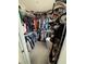 Well-organized walk-in closet with ample hanging space and shelving for optimal storage solutions at 2883 Narcoossee Commons Way, St Cloud, FL 34771