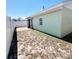 Backyard featuring green and brown grass and a partial brick patio leading to a screened-in porch at 3208 Timberline Road, Winter Haven, FL 33880