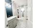 Beautiful bathroom with modern sink and vanity, updated tile, and shower-tub combo at 3208 Timberline Road, Winter Haven, FL 33880