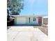 Charming single-story home featuring a red door, garage and well-maintained lawn at 3208 Timberline Road, Winter Haven, FL 33880