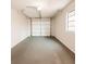 Spacious one car garage with painted floor and walls, along with an automatic door at 3208 Timberline Road, Winter Haven, FL 33880