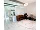 Open-concept living room with high ceilings, neutral color palette and white marble floors at 3208 Timberline Road, Winter Haven, FL 33880