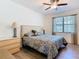 Bedroom featuring a ceiling fan, a window, and neutral paint at 343 Scripps Ranch Rd, Poinciana, FL 34759