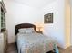 Comfortable bedroom featuring stylish decor, including a bed and decorative lamp at 343 Scripps Ranch Rd, Poinciana, FL 34759