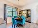 Dining room with window, modern light fixture, and decorative storage cabinet at 343 Scripps Ranch Rd, Poinciana, FL 34759