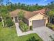 Charming single-Gathering home with a brick-paved driveway, well-maintained landscaping, and a two-car garage at 343 Scripps Ranch Rd, Poinciana, FL 34759