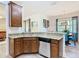Well-appointed kitchen featuring a dishwasher and stylish dining area at 343 Scripps Ranch Rd, Poinciana, FL 34759