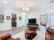 Bright living room with an open floor plan that flows into the kitchen at 343 Scripps Ranch Rd, Poinciana, FL 34759