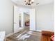 View of the living room with hardwood floors, seating, and an open doorway at 343 Scripps Ranch Rd, Poinciana, FL 34759