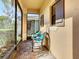 Relaxing screened-in porch with comfortable seating and views of the outdoors at 343 Scripps Ranch Rd, Poinciana, FL 34759