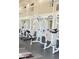Community fitness center featuring multiple weight machines and plenty of natural light at 4528 Commander Dr # 2013, Orlando, FL 32822