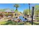 Scenic pond with a fountain, gazebo, rocks, palm trees, and well-maintained landscaping at 4528 Commander Dr # 2013, Orlando, FL 32822