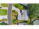 Aerial view of a lovely property featuring manicured lawn, mature trees, and driveway at 508 Alcazar Ct, The Villages, FL 32159