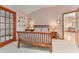 Cozy bedroom featuring a light color palette, natural wood furniture, and ample natural light at 508 Alcazar Ct, The Villages, FL 32159