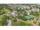 Aerial shot of a community with pool, tennis courts, golf course, sand volleyball, and clubhouse at 508 Alcazar Ct, The Villages, FL 32159