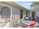 Charming patio area with comfortable wicker seating, perfect for outdoor relaxation and entertaining at 508 Alcazar Ct, The Villages, FL 32159