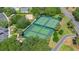 Aerial view of multiple tennis courts in a well-maintained community setting, great for recreation at 508 Alcazar Ct, The Villages, FL 32159