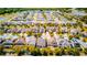 An aerial view of a well-planned community featuring neatly arranged homes and lush landscaping at 5118 Tiber Way, St Cloud, FL 34771