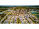 Aerial view of a suburban neighborhood featuring homes, ponds, and well-maintained streets at 5118 Tiber Way, St Cloud, FL 34771