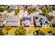 Aerial view showcasing homes with solar panels, promoting sustainable energy solutions at 5118 Tiber Way, St Cloud, FL 34771