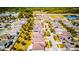 Aerial view showcases a residential neighborhood, green spaces, and roadways from above at 5118 Tiber Way, St Cloud, FL 34771