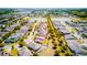 Aerial view of homes surrounded by lush trees, complemented by picturesque lake at 5118 Tiber Way, St Cloud, FL 34771