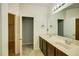 Bathroom featuring double sinks, a large countertop, and vanity with dark wood cabinets at 5118 Tiber Way, St Cloud, FL 34771