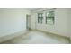 Bright bedroom featuring natural light from windows, neutral walls, and carpeted flooring at 5118 Tiber Way, St Cloud, FL 34771