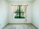 Bright bedroom with large window providing ample natural light and a view of the outdoors at 5118 Tiber Way, St Cloud, FL 34771