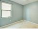Blue bedroom featuring natural light, neutral carpet, and ceiling fan at 5118 Tiber Way, St Cloud, FL 34771