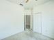 Neutral bedroom showcasing spacious closet and white trim at 5118 Tiber Way, St Cloud, FL 34771
