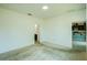 Spacious bedroom with neutral walls and doorways leading to bathroom and kitchen at 5118 Tiber Way, St Cloud, FL 34771