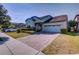 Charming single-Gathering home with a brick driveway, well-maintained landscaping, and a two-car garage at 5118 Tiber Way, St Cloud, FL 34771