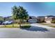 Charming front exterior with a well-manicured lawn and a welcoming two-car garage at 5118 Tiber Way, St Cloud, FL 34771