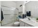 Well-lit full bathroom with shower, tub, and ample counter space at 523 Shell Creek St, Poinciana, FL 34759