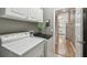 Efficient laundry room with modern machines and convenient storage at 523 Shell Creek St, Poinciana, FL 34759