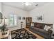 Comfortable living room with a cozy couch, natural light, and view of backyard at 523 Shell Creek St, Poinciana, FL 34759