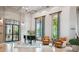 Elegant lobby with a grand piano, comfortable seating, and large windows showcasing the lush outdoors at 523 Shell Creek St, Poinciana, FL 34759