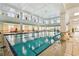 Bright indoor pool facility with ample natural light and tiled floors at 523 Shell Creek St, Poinciana, FL 34759