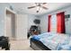 Bedroom featuring a ceiling fan, tiled floor, and a computer for gaming and streaming at 53 Zinnia E Ln, Kissimmee, FL 34759