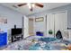 This bedroom features a ceiling fan, and a walk-in closet at 53 Zinnia E Ln, Kissimmee, FL 34759