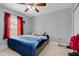 This bedroom has a ceiling fan, tiled floor, and a view to the outside at 53 Zinnia E Ln, Kissimmee, FL 34759