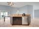 Open kitchen area boasting granite countertops and stainless steel dishwasher at 53 Zinnia E Ln, Kissimmee, FL 34759
